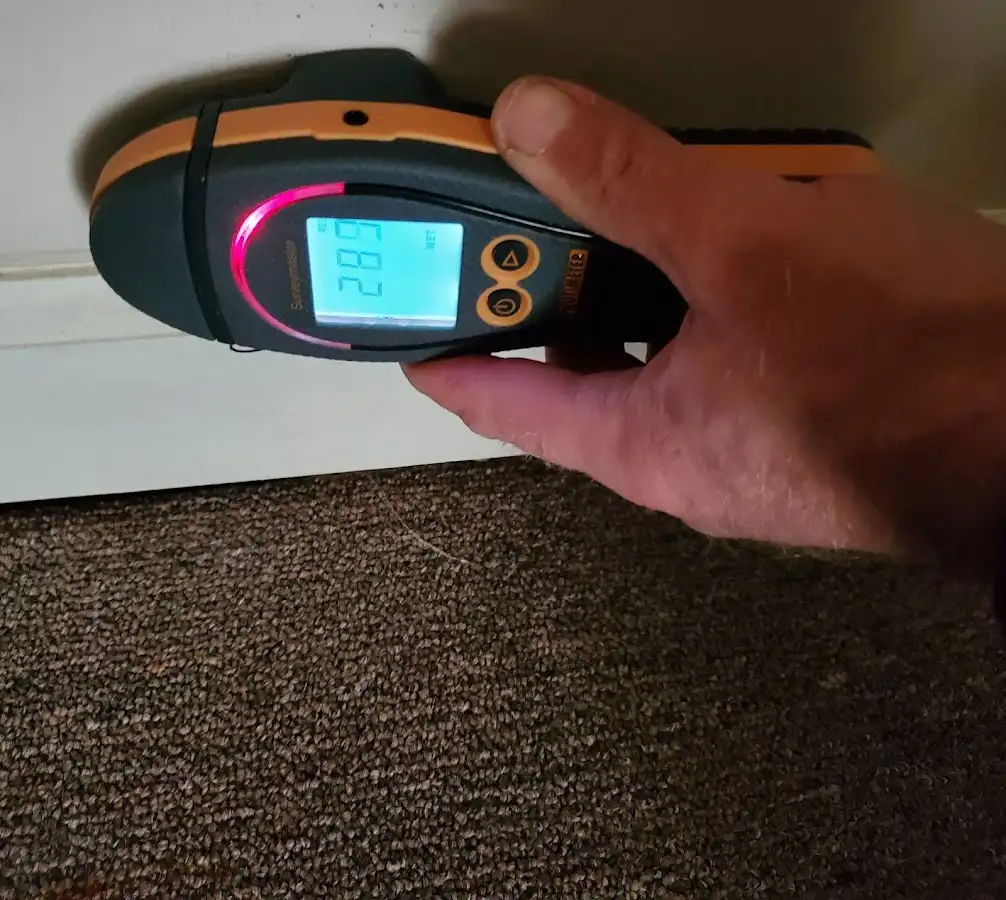 Moisture detection at baseboard during Burst Pipe Cleanup in Temescal Valley